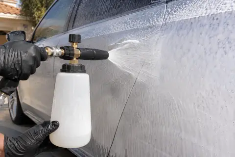 Foam shampoo being applied to a car exterior