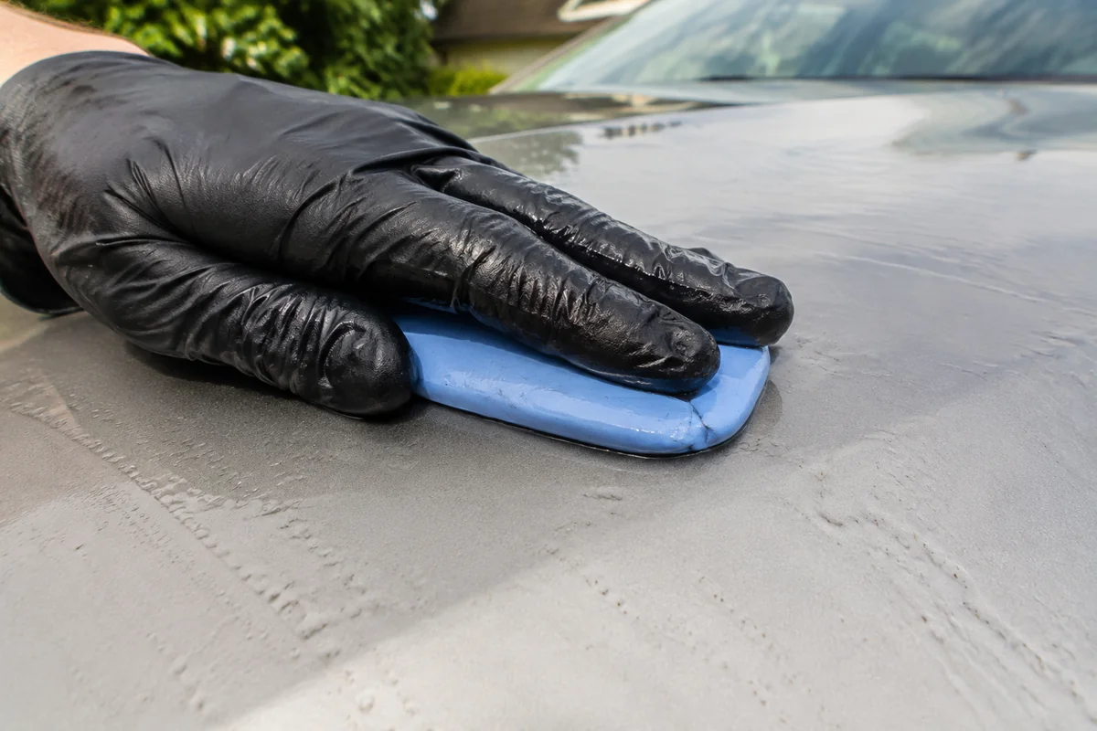 Close-up of vehicle care during outdoor mobile detailing